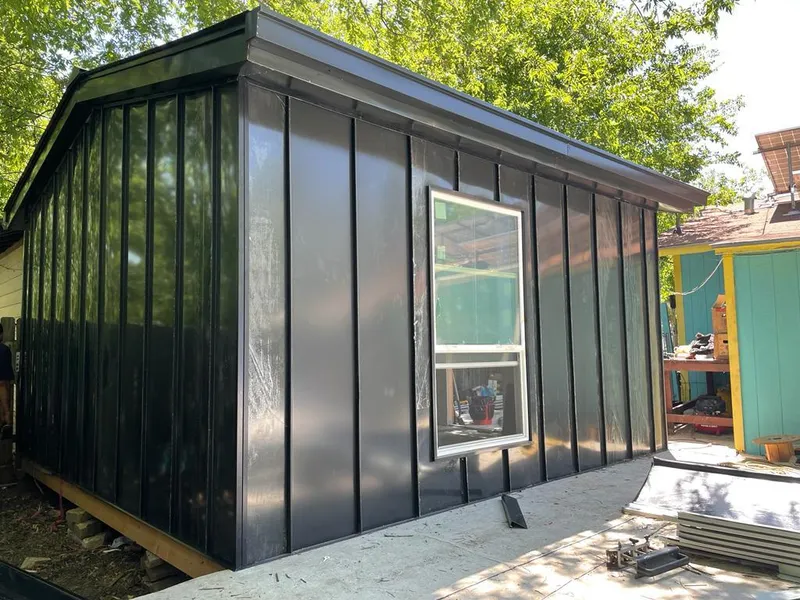 Black standing seam metal wall panels for Roof Inspection in Thompson's Station