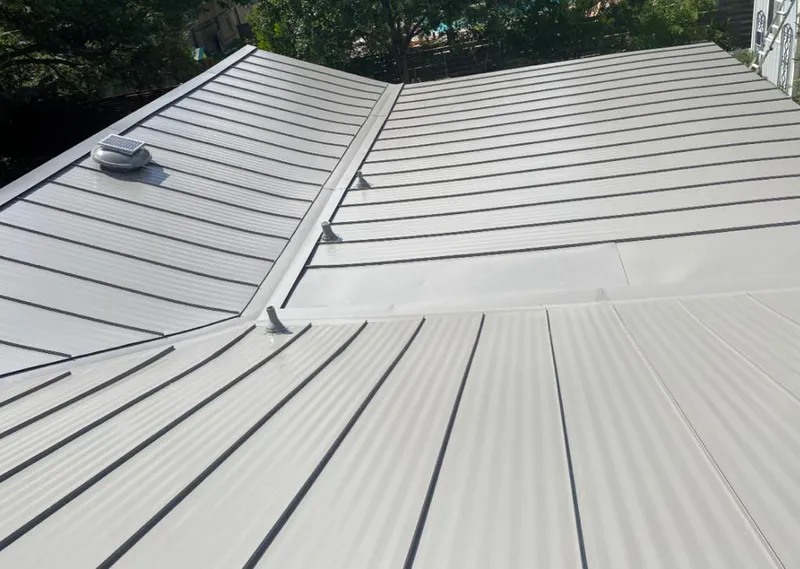Solar attic fan installed on a metal roof for Roof Ventilation in Thompson's Station